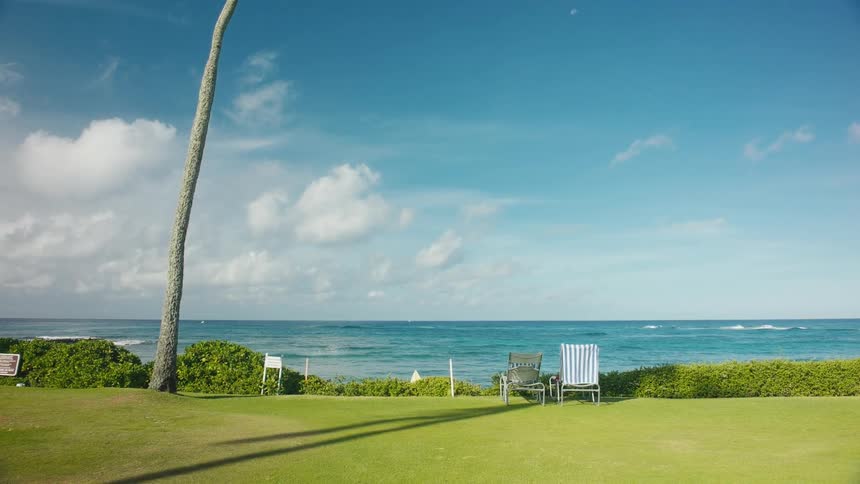 Panorama of a beach with a view of a grassland facing the sea