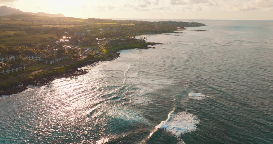 Sun shines across coastal town on a hazy day