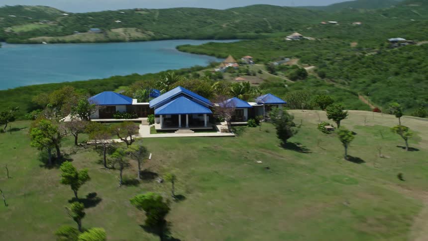 Aerial of a hilltop resort on a tropical island
