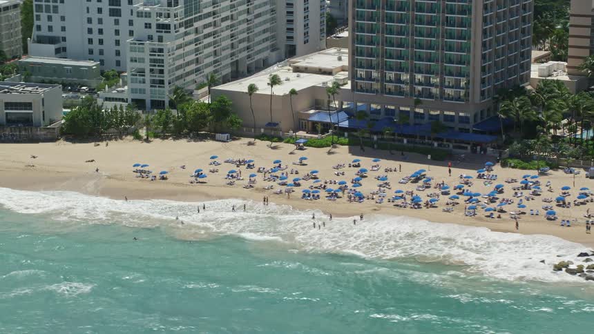 An aerial view of people laying out on the beach