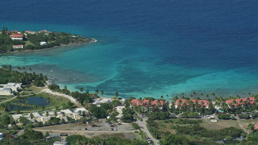 Homes line the shore on the tropical island