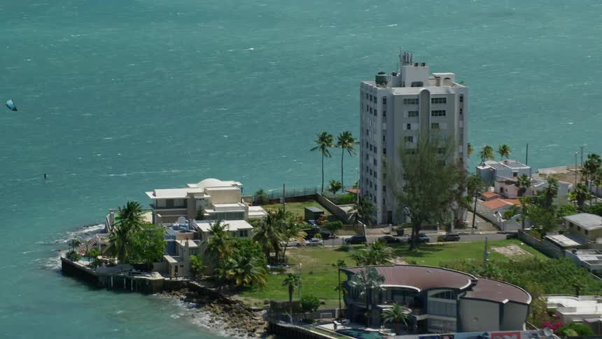 Aerial panorama of a turquoise blue beach with seaside hotels