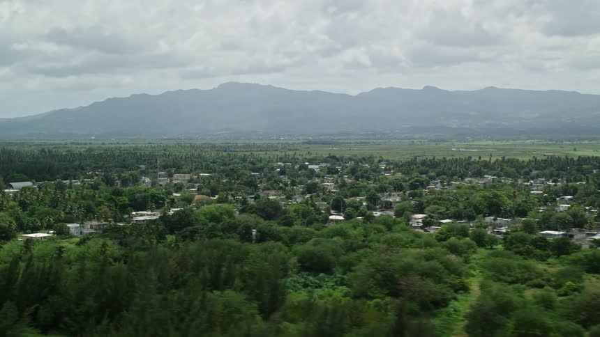 A city with several houses and many trees in the middle of the region