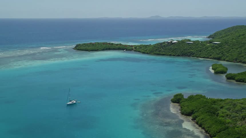 Skyline of a tropical island with crystal clear water during the hot day