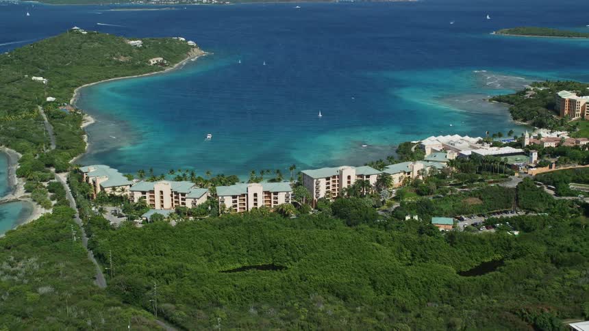 Aerial panorama of a beachfront resort in a bay