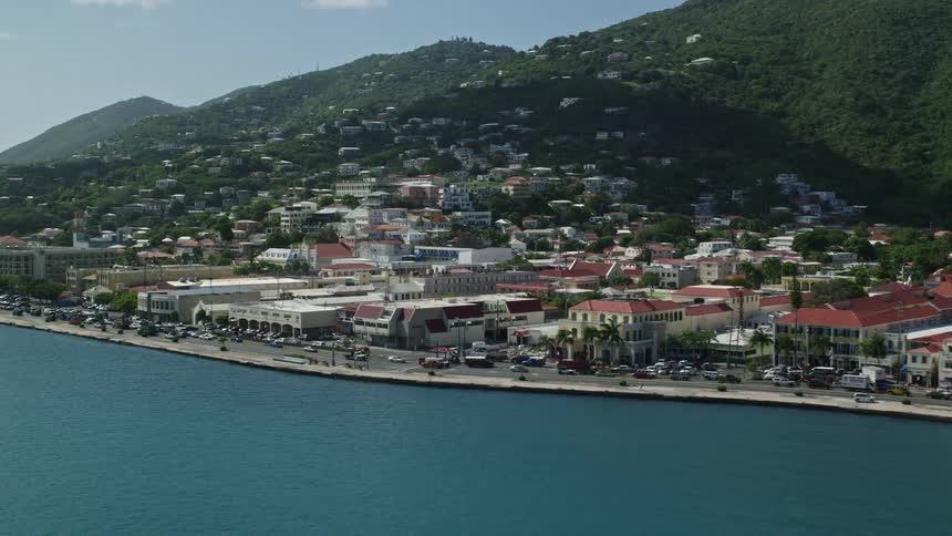 Traffic runs past the coastal town