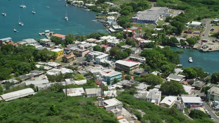 Aerial view cpastal community harbor homes and boats