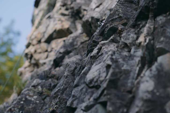 Closeup of a rope on a rocky mountain