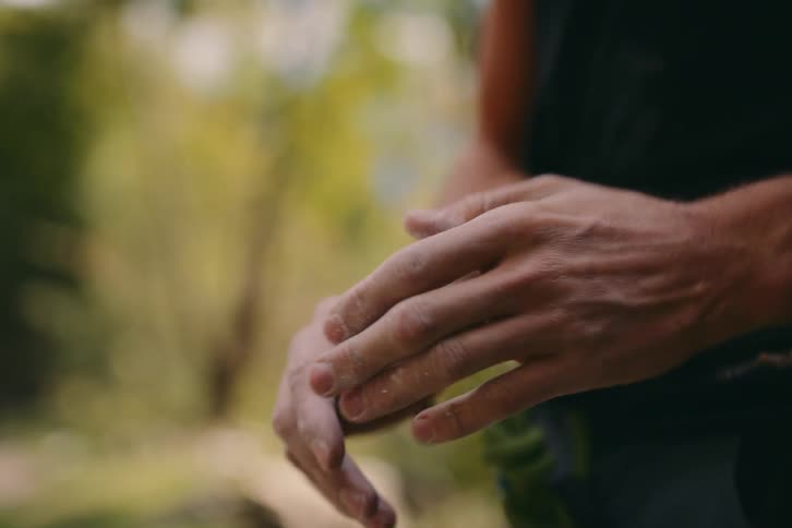 A clip of a person dusting his hands