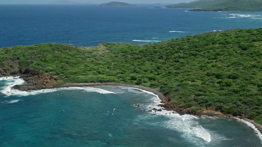 An archipelago with a huge islands full of green vegetation in a blue ocean