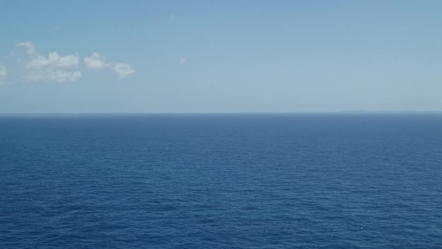 Panorama of the sea on a day with a clear blue sky and few clouds