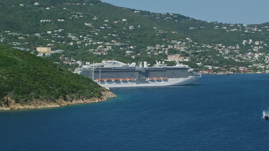 A cruise ship docked on an island