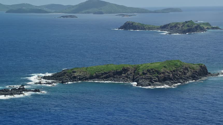 Aerial view of island chain in blue ocean water