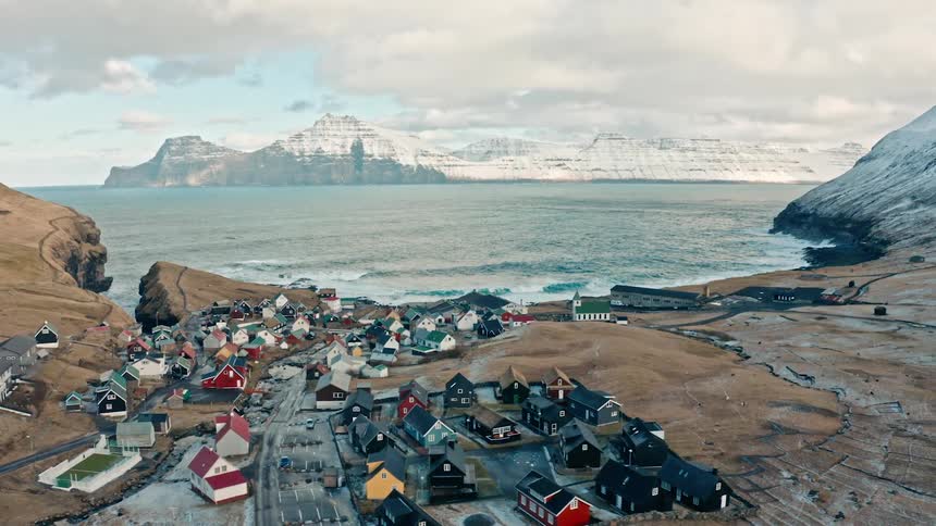 An aerial view of a small rural community on a winter day