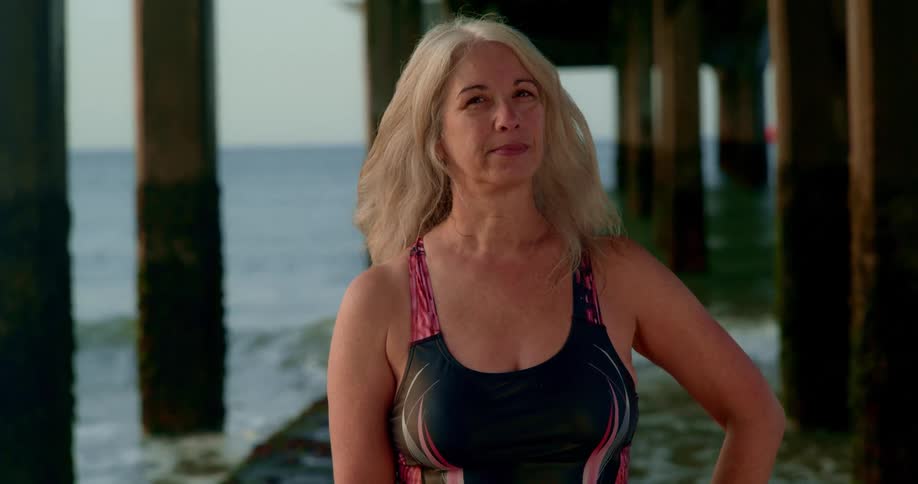A portrait of a blonde lade by the sea shore
