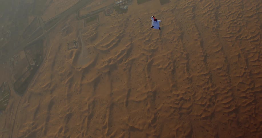 A clip of a person skydiving in the desert