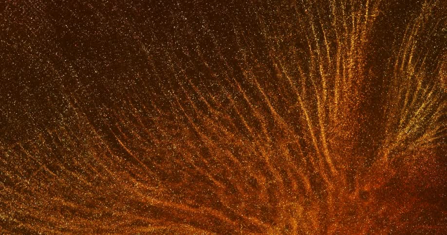 Abstract and shiny gold watery fluid in slow motion