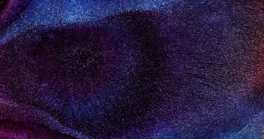 Shiny fluid with dark tones in slow motion