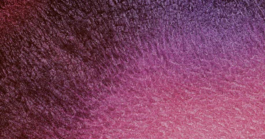 Closeup of abstract pink fluid in slow motion