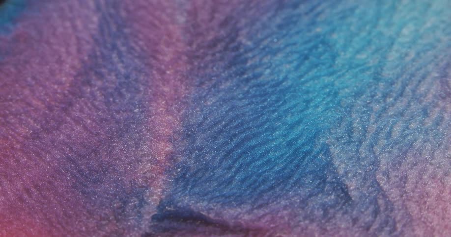 Shiny fluid of blue and pink color mixed in an abstract way