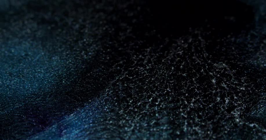 Extreme closeup of abstract slowmotion movement of a watery fluid