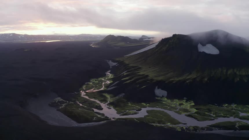 Aerial of a volcanic mountain near a river