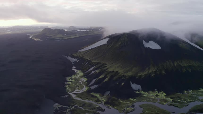 Aerial of a volcanic mountain during a cloudy day