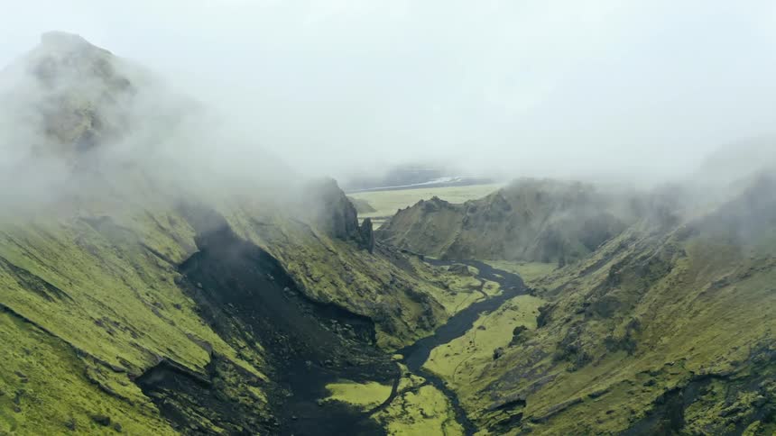 Aerial panorama of a green mountain range in Iceland
