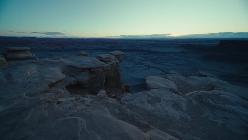Panoramic view of a rocky and sandy valley at dawn