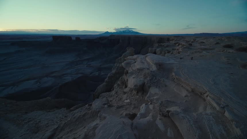 Rocky canyon landscape low clouds on horizon at blue hour dusk