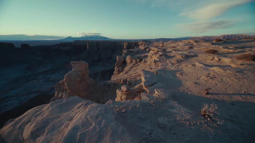 Shadows fill canyon in desert terrain on a cloudy day