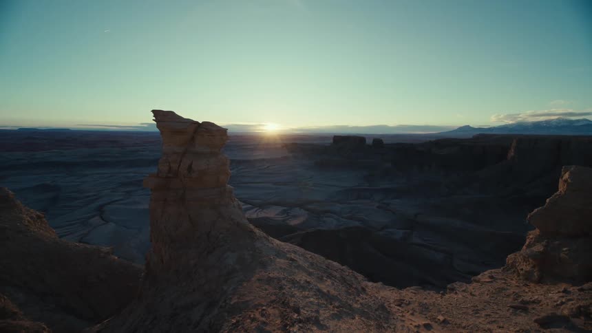 Skyline of a canyon between rocky mountains in the desert at sunset