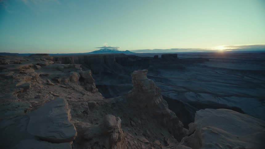 Panorama of geological canyons with the sunrise on the horizon