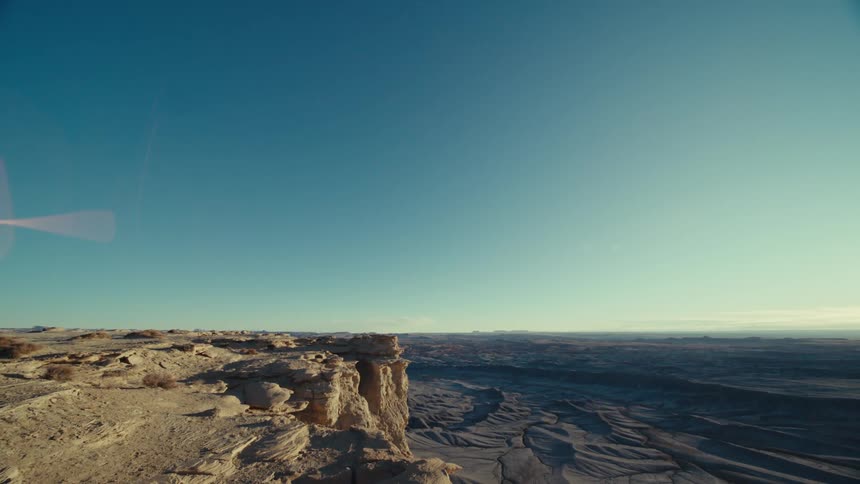 Blue sky rock formations under horizon