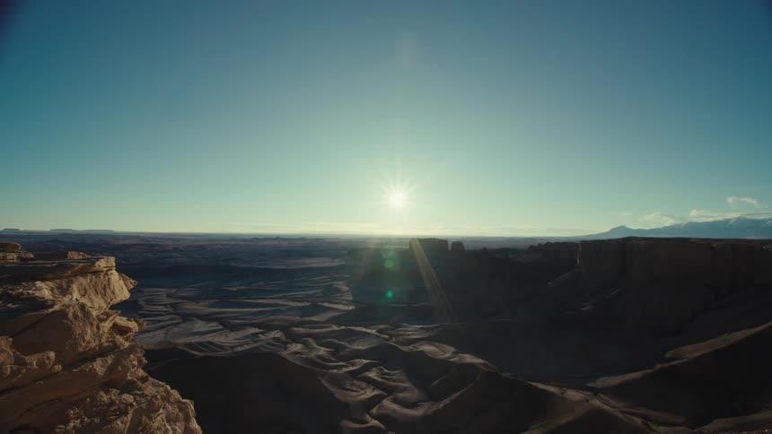 Chain of geological valleys with the sun on the horizon