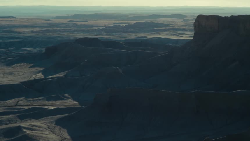 Aerial view of canyons and rocky terrain on a morning