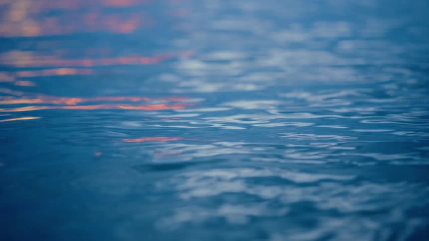 Closeup of the calm waters of the sea with sunlight reflection