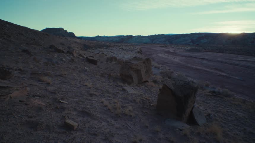 A sandy soil with some stones in a morning