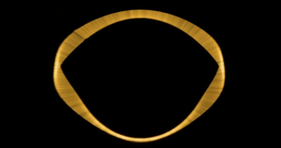 A golden circle rotates on the dark screen