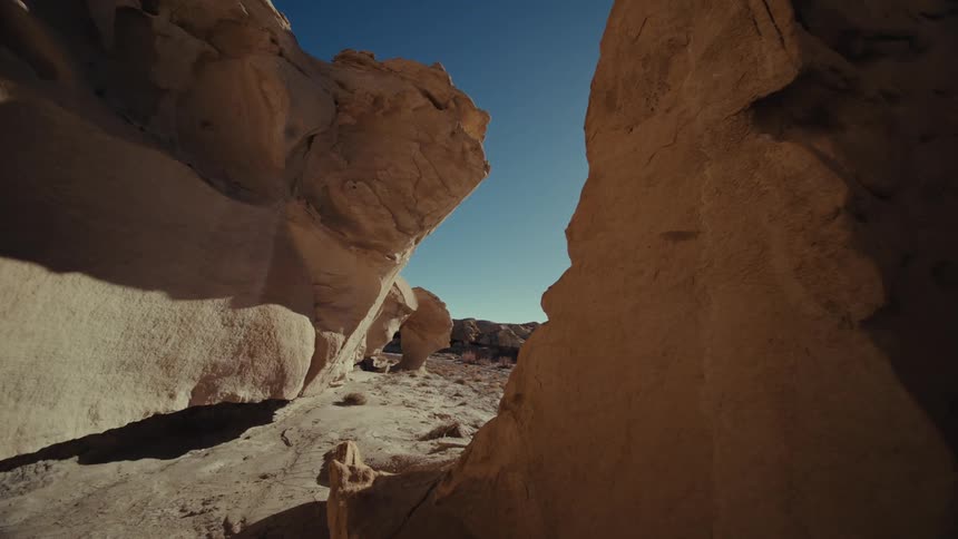 A canyon formation in a desert during the day