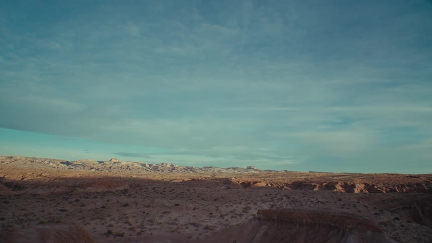 Panoramic view of a desert terrain with rocks and valleys on the horizon