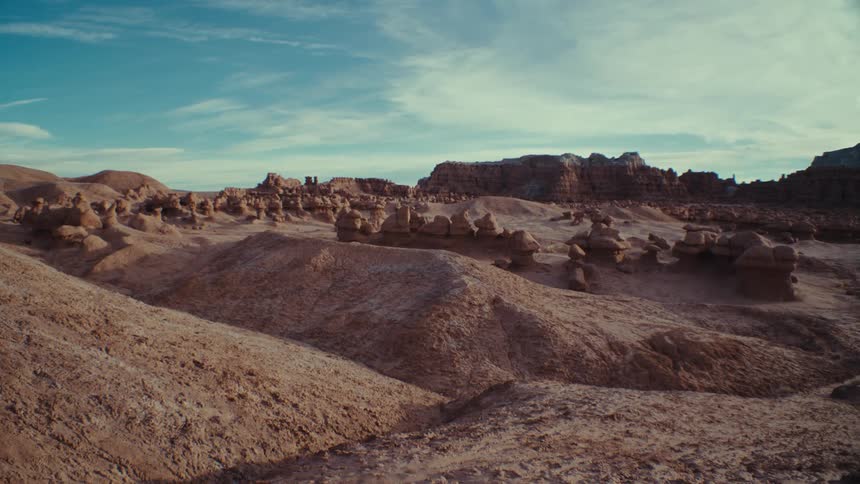 Desert view with geological rocks and canyons in the background