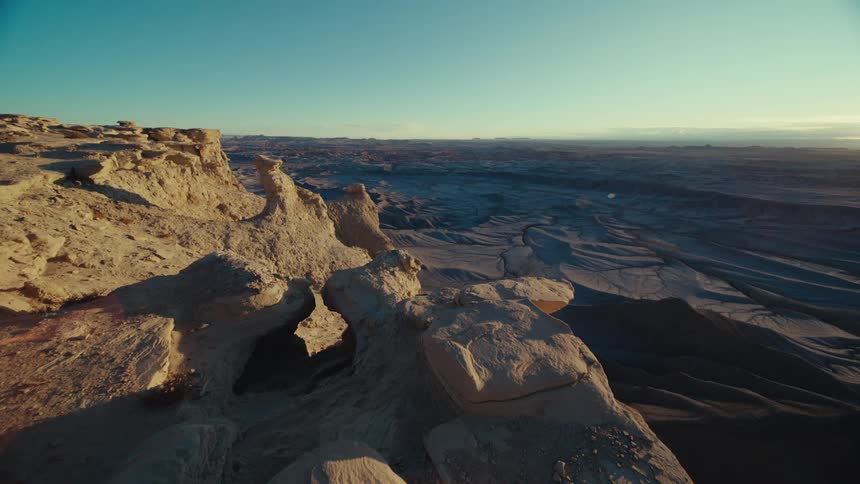 Aerial panorama over canyons and geological rocks under a morning sky