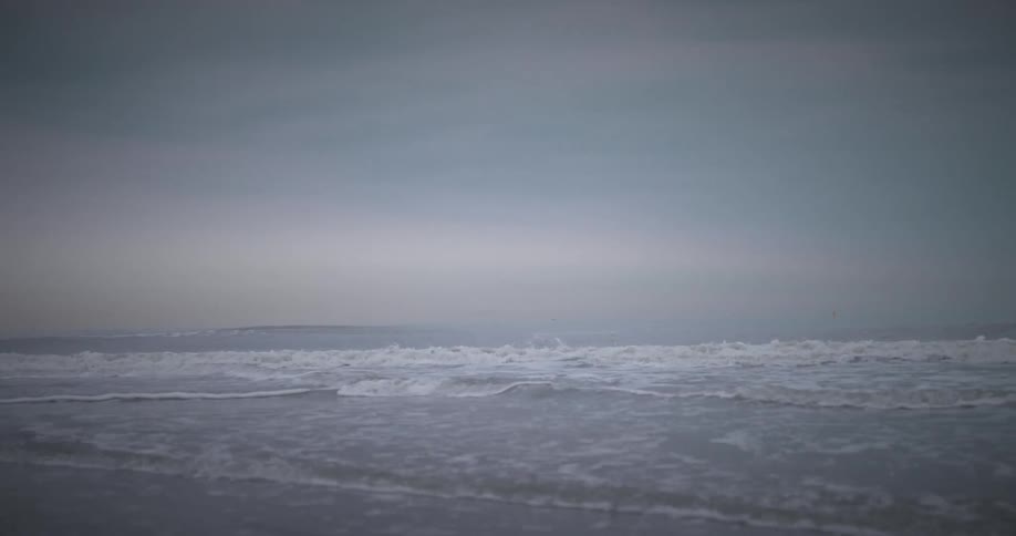 A view of waves crashing on a beach