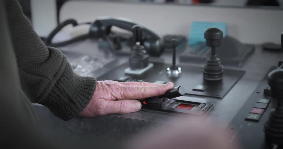 Closeup of an elderly persons hand manipulating a mobile button