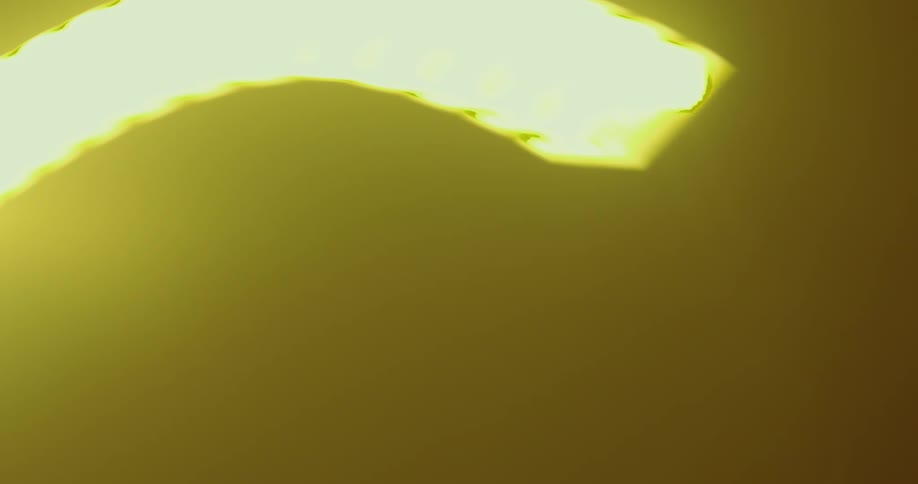 Ceiling light passes overhead during passage through tunnel