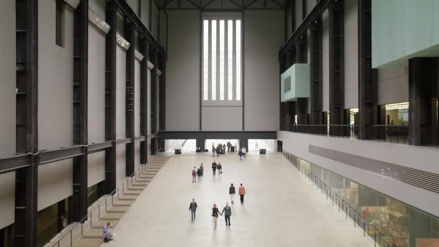 Topdown and interior view of Tate Modern with people walking