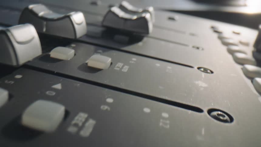 Dials on a mixing desk moving by themselves
