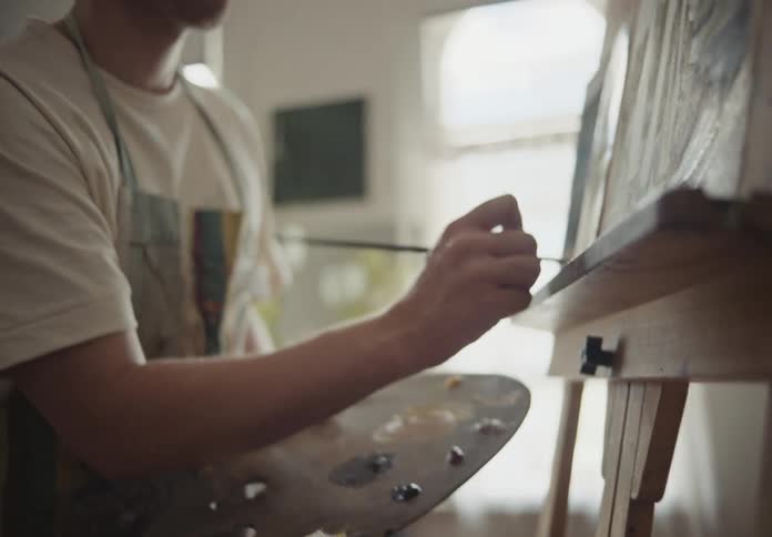 Portrait of a man painting a picture
