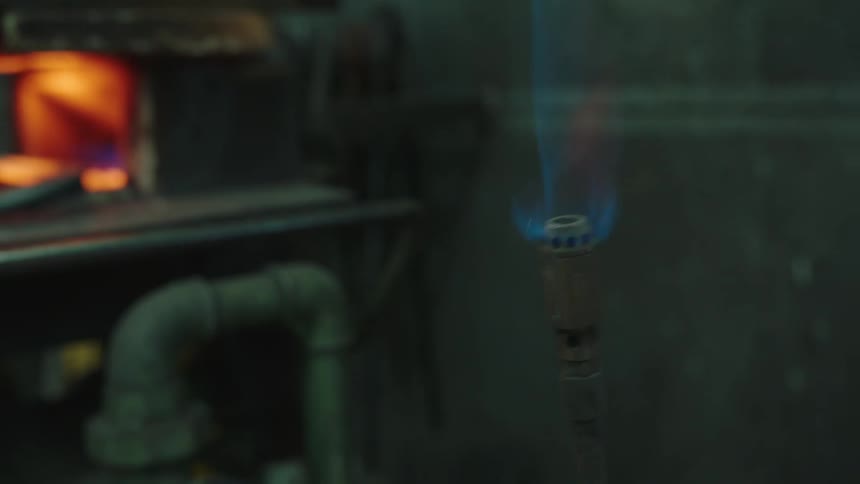 Loud flames from a furnace in a room